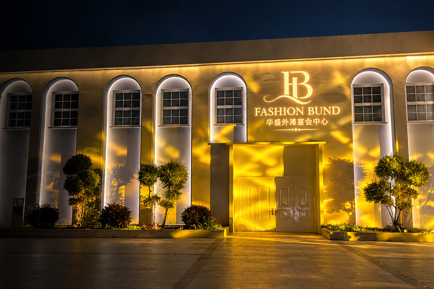 Fashion Bund name and logo projected above an illuminated event venue entrance.